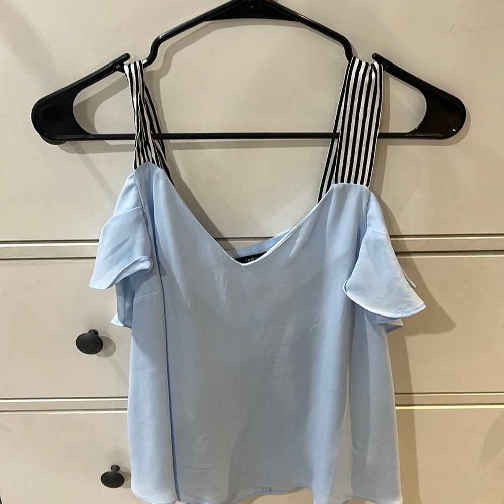 Baby blue top with black and white straps